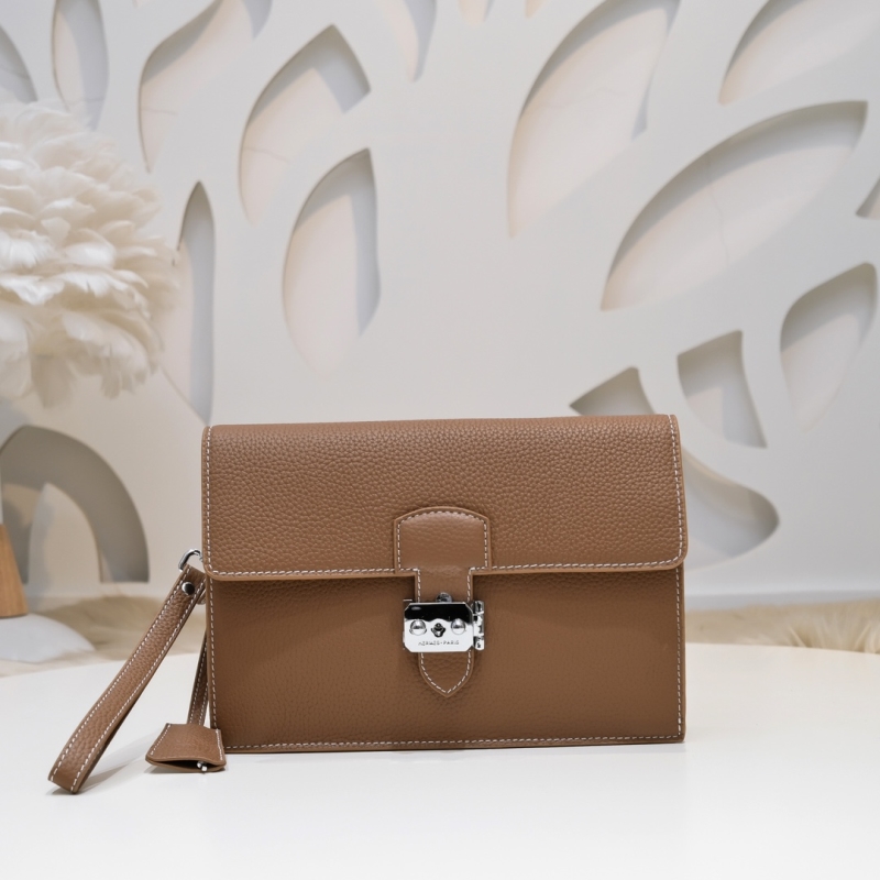 H**mes clutch bags